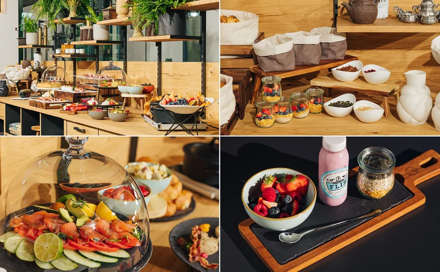 Buffet with fresh fruit, vegetables, yogurt, and granola in a restaurant