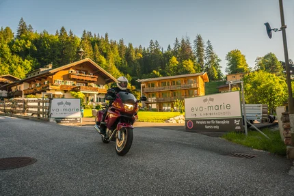 Motorcyclist in front of Eva-Marie & Motorcycle Hotel entrance