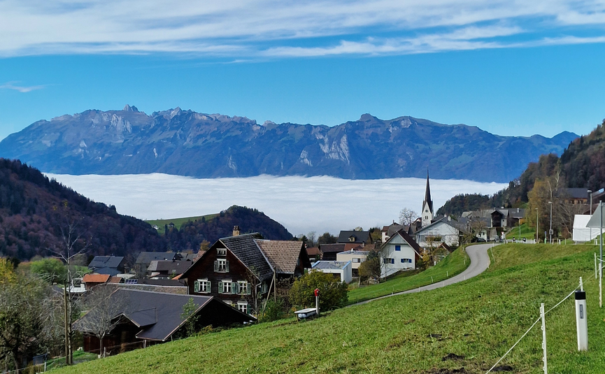 MoHo Schönauer Hof tour 11 Schwägalp Village with green fields and mountains in the background under blue sky