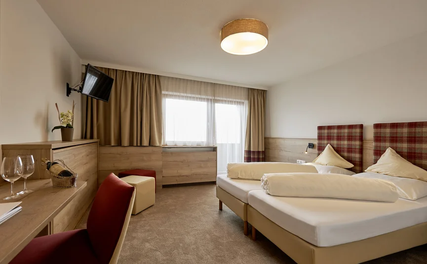 Cozy hotel room with double bed and TV