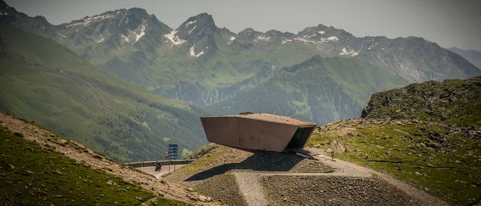 Modern viewing platform in the Alps with mountain panorama