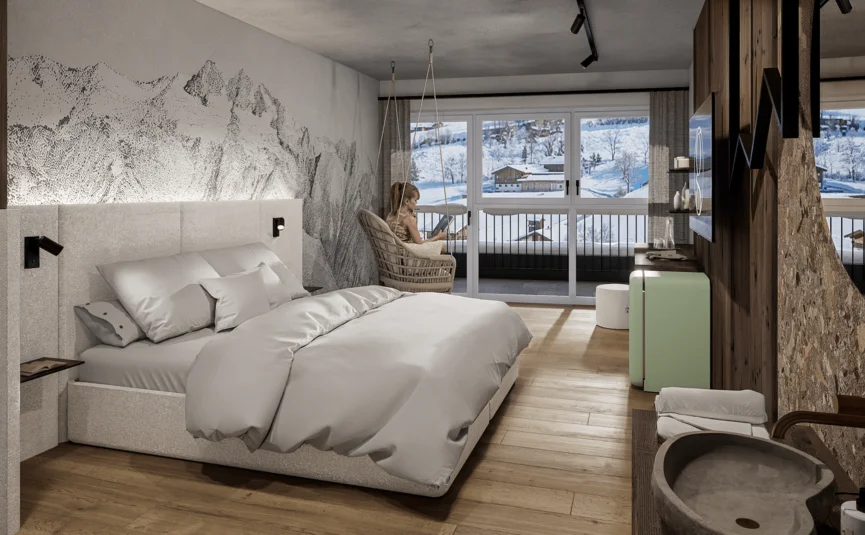 Schlafzimmer mit Doppelbett, Balkon und verschneiter Berglandschaft
