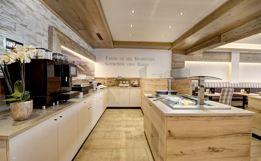 Modern breakfast room with buffet and beverage machine