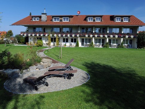 Hotel Bergblick © Hotel Bergblick House with balcony, flowers, and lounge chairs on well-kept lawn