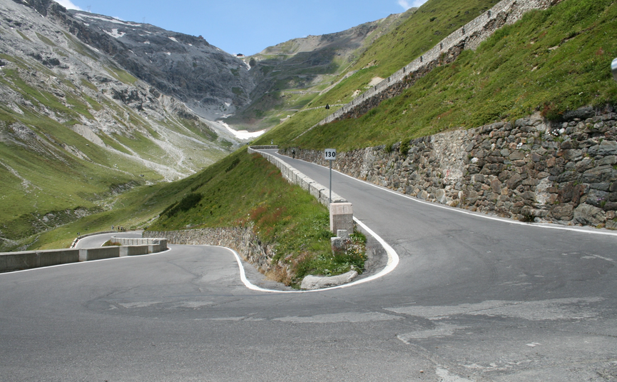MoHo Schönauer Hof Tour Stelvio Variant 3 Livigno Mountain switchback road with steep slopes and stone walls