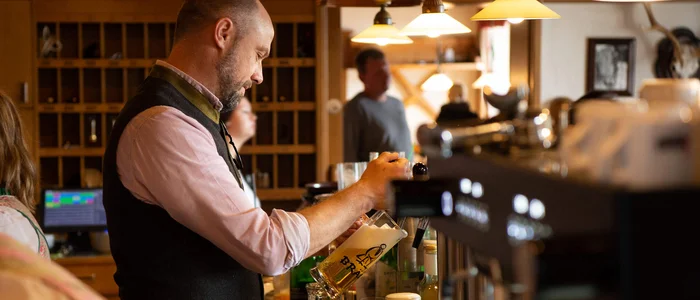 Man pouring beer in a traditional pub
