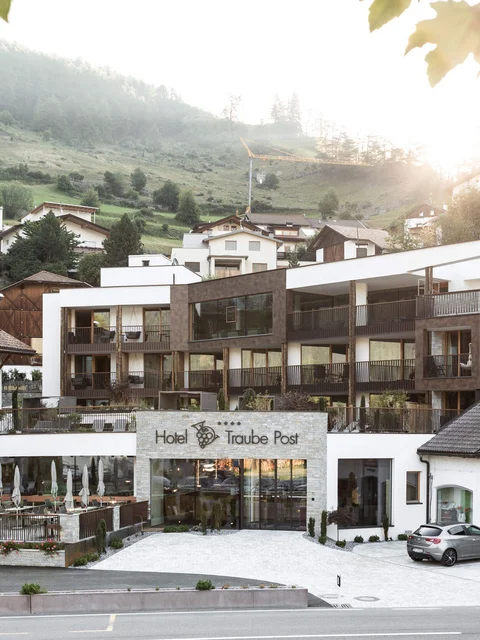 Hotel Traube Post in mountain village at sunset