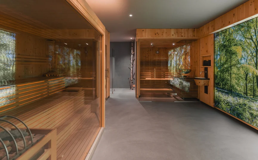 Modern sauna area with glass doors and wooden interior