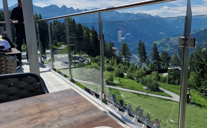 MoHo Schönauer Hof- Tour 12 Stilfserjoch Umbrail Coffee cup on table with mountain view from terrace