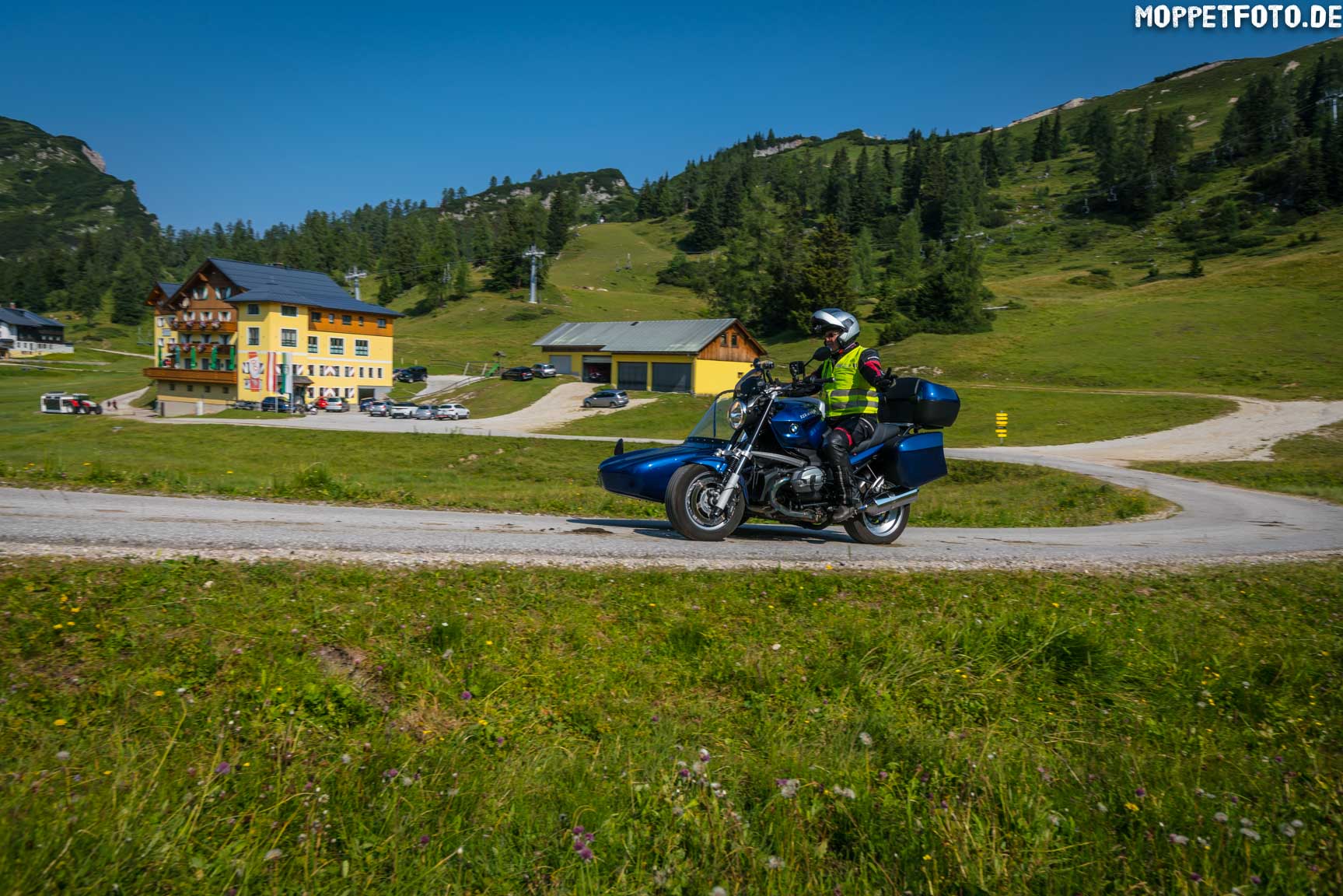 Almhotel & Genussgasthof Hierzegger ***S © Moppetfoto.de Motorcyclist with sidecar on country road near alpine hotel on sunny day