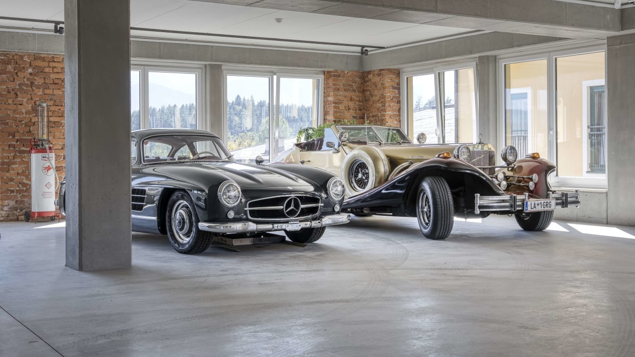 Two classic Mercedes-Benz vintage cars in a bright garage